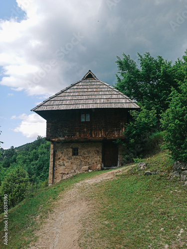 Old traditional house at Sopotnica village in Serbia photo