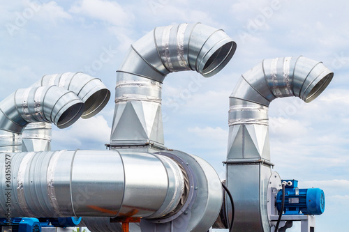 The galvanized pipes of the branching system are installed on the roof of the building.