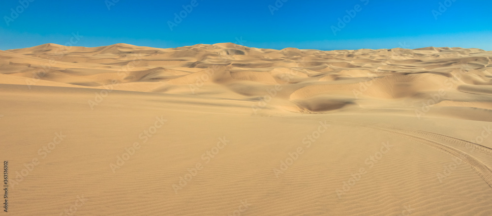Big sand dunes panorama. Desert and coastal beach sand landscape scenery. Abstract background.