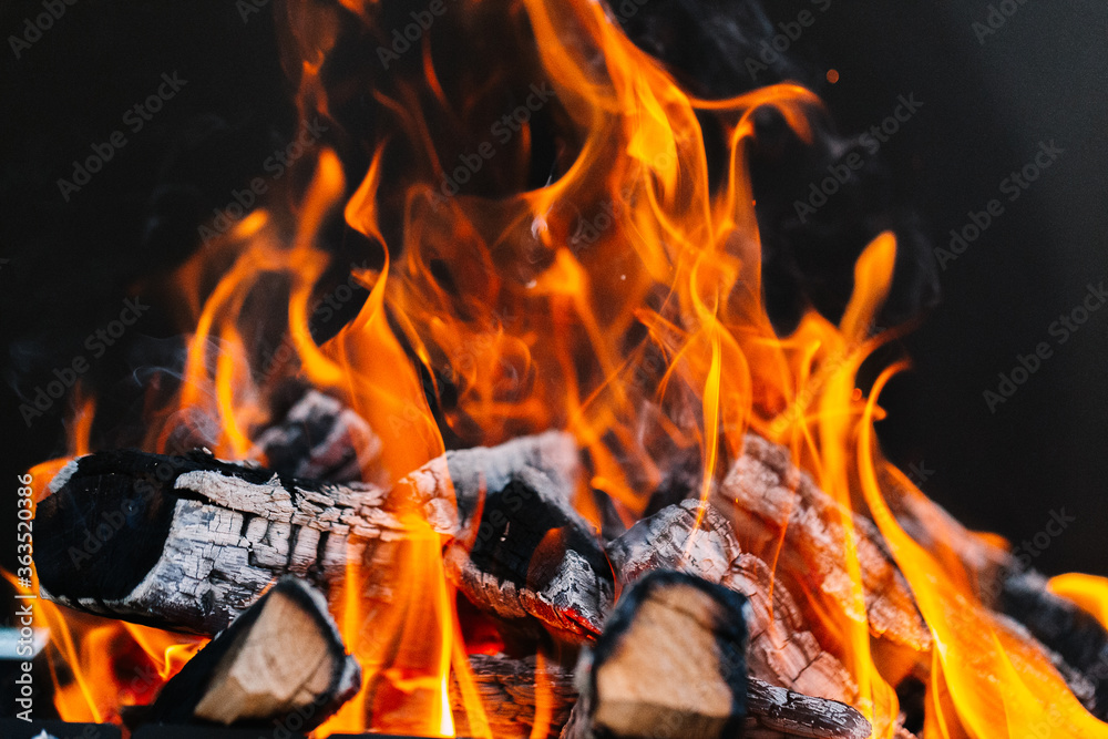burning firewood in a barbecue or barbecue. burning firewood in a barbecue or barbecue.