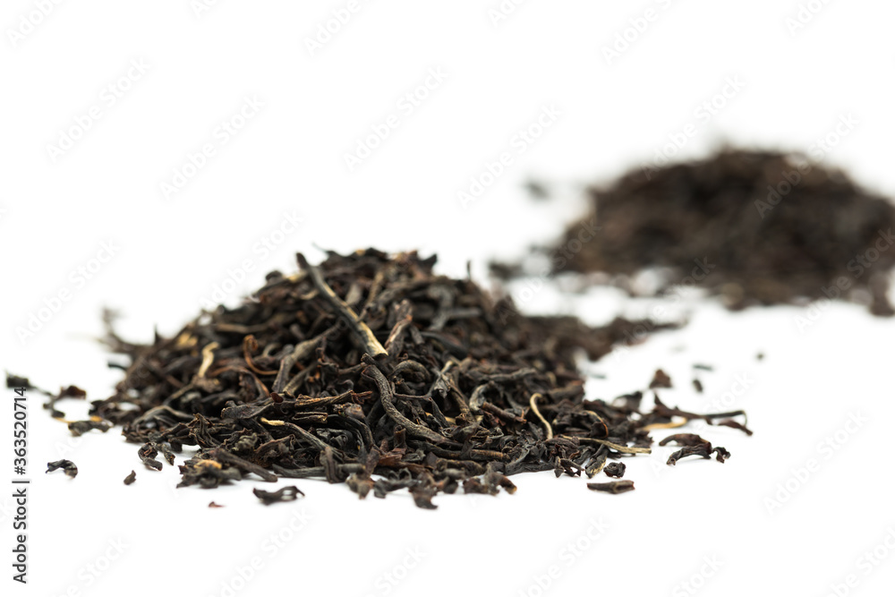 Leaves of black premium dry tea on a white background Leaves of black premium dry tea on a white background