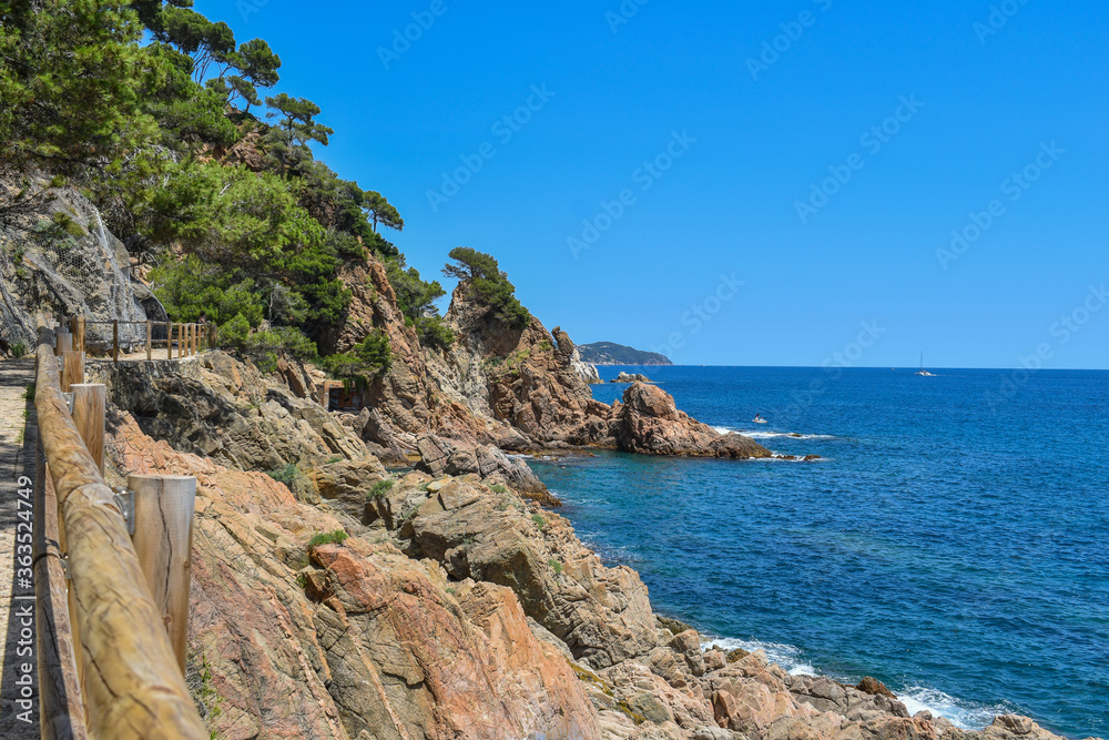 Costa brava spain, stone path next to mountains with sea views