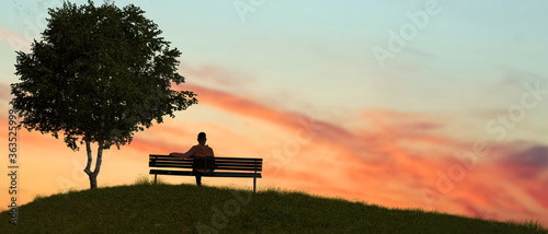 Foto A man sitting on a bench in nature outdoor sunset.