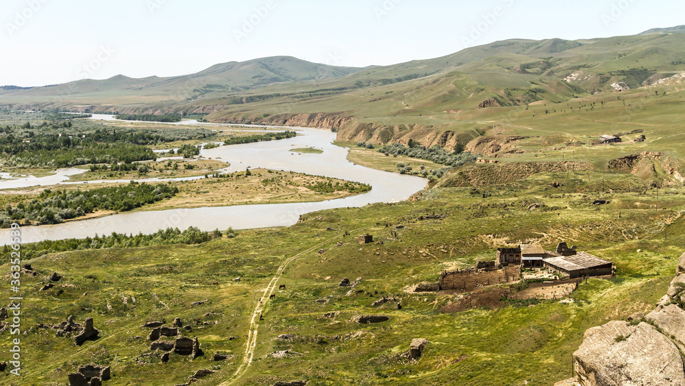 Ruins of an ancient village near ancient Uplistsikhe cave town in Georgia. Mountainous landscape of Uplistsikhe