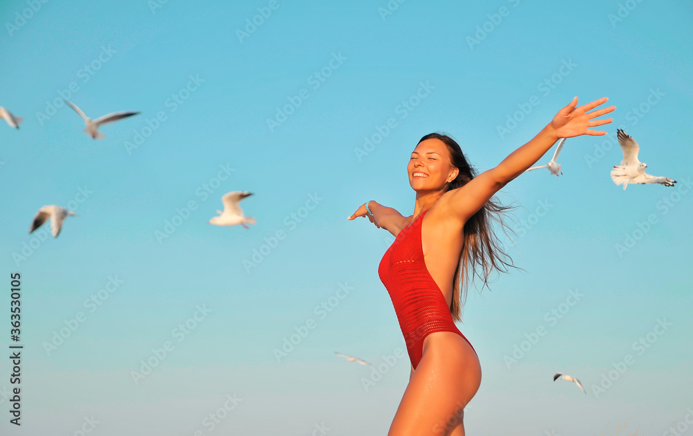 beautiful woman on the beach feels freedom beautiful woman on the beach feels freedom