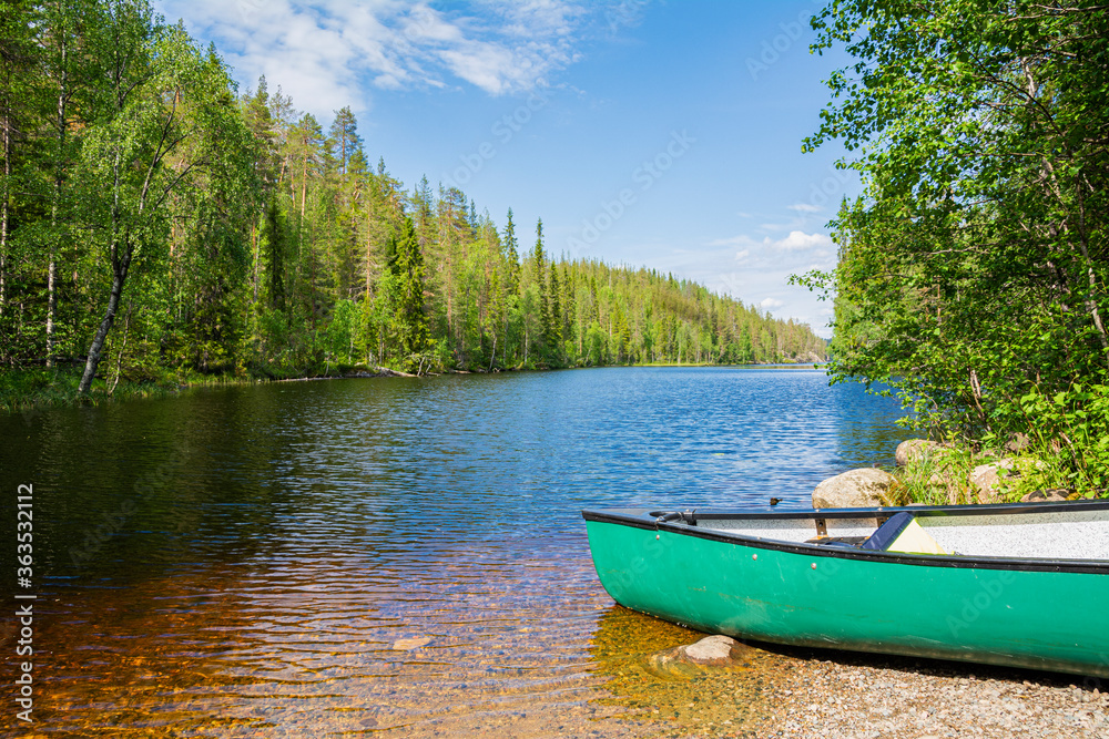 View of the canyon lake Julma-Olkky and canoe on the shore, Hossa National Park, Kuusamo, Finland