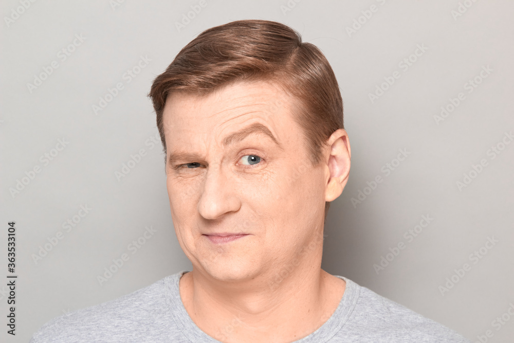 Portrait of happy charismatic mature man with one eyebrow raised Portrait of happy charismatic mature man with one eyebrow raised