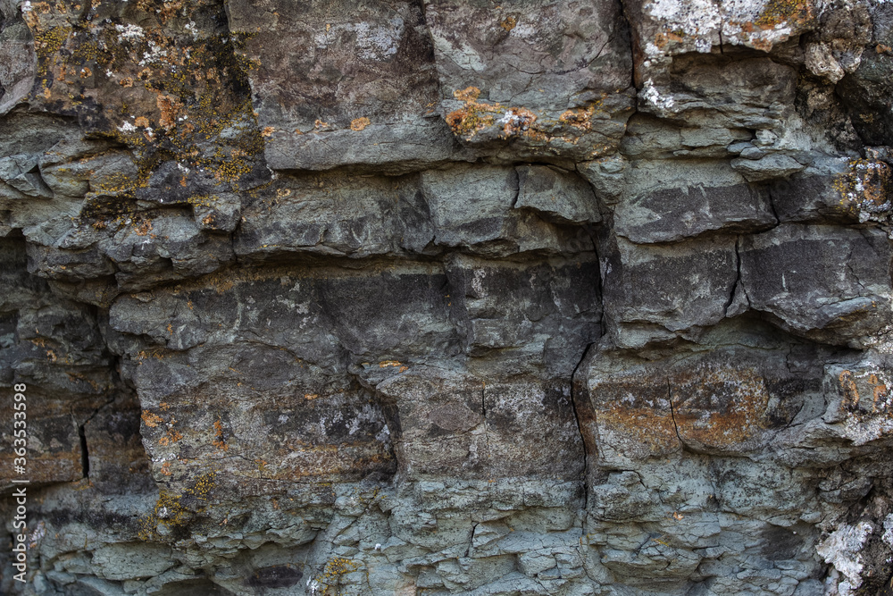 Stoun rock is fractured, with cracks forming interesting fragments and interesting texture