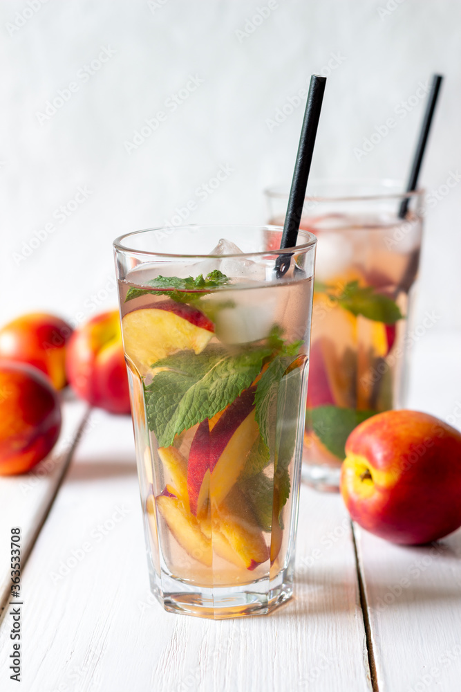 Cold peach tea with mint. Cold drinks. Healthy eating. Vegetarian food. Cold peach tea with mint. Cold drinks. Healthy eating. Vegetarian food.