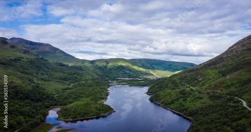 aerial footage over loch leven showing kinlochleven on the west highland way long distance hiking trail in the argyll and lochaber region of the highlands of scotland during a summer evening