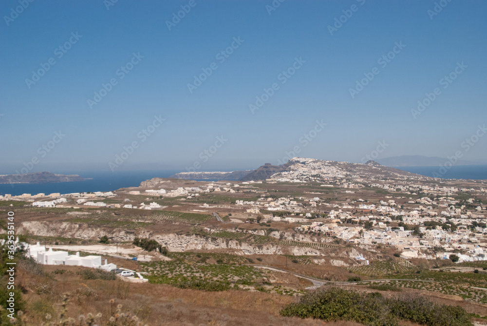 highlands, the city is visible in the distance,  blue sky