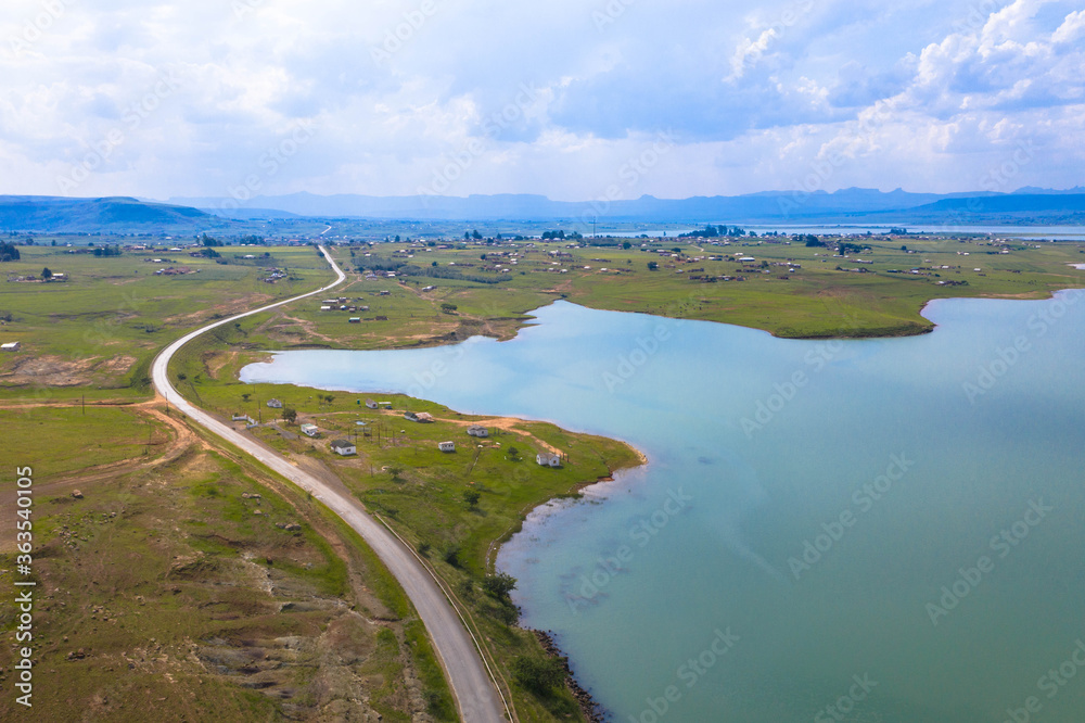 Fototapeta premium Country road along the Tugela River below the Woodstock Dam Wall near Bergville in the Kwazulu-Natal Province