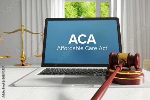 ACA (Affordable Care Act). Law. A lawyer laptop on a desk in the office. Text on the screen. Libra, Juctice, Web photo