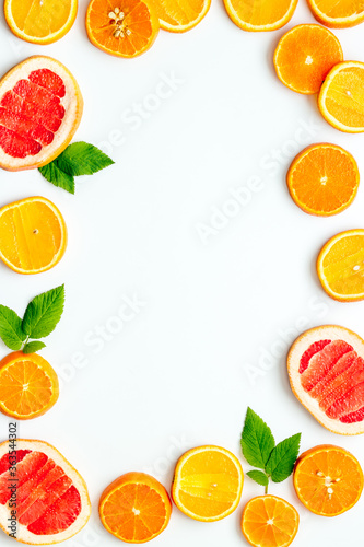 Frame sliced citrus mix white background top view