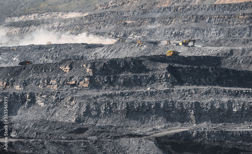 Geological section of soil, layers of coal and rock. Overburden open mine anthracite. Dark texture black color
