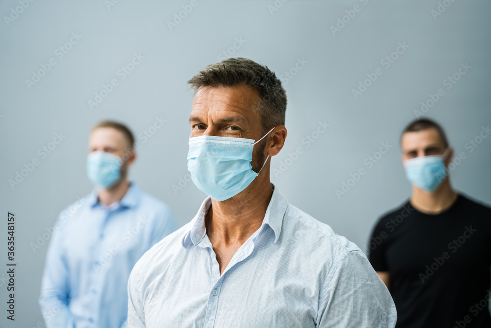 Group Of Office Employees Wearing Face Masks