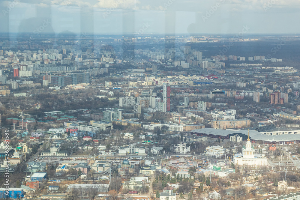 Russia, Moscow, 2019: view from the Ostankino TV tower to the panorama of the city, multi-storey residential buildings and the VDNH park