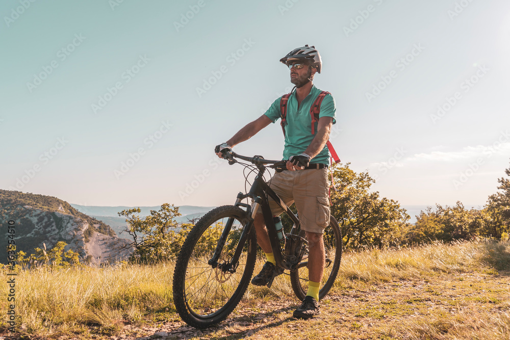 Man riding his mountain bike outdoor in nature Man riding his mountain bike outdoor in nature