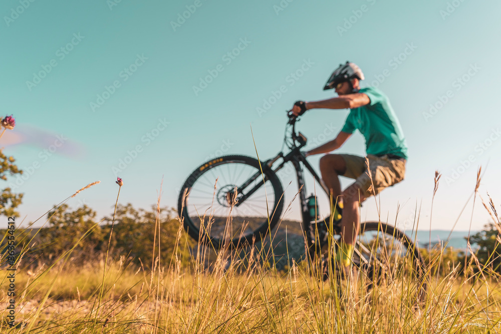 Man riding his mountain bike outdoor in nature Man riding his mountain bike outdoor in nature