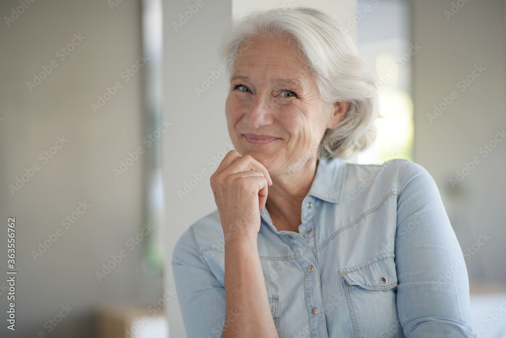 Portrait of smiling senior woman with white hair