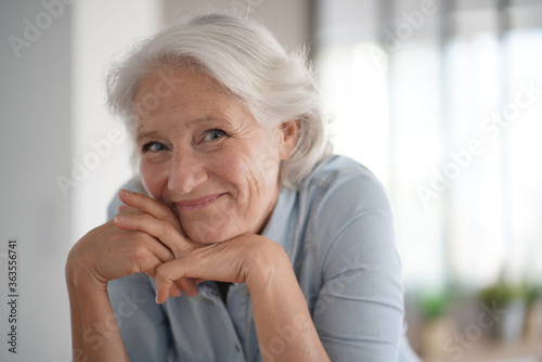 Portrait of smiling senior woman with white hair