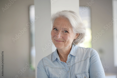 Portrait of smiling senior woman with white hair