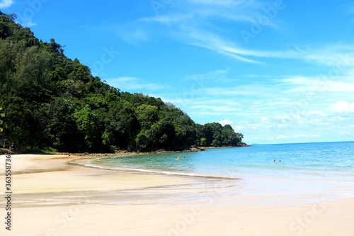 Coast of beach and small hill with green trees and blue sky view at langkawi-Malaysia