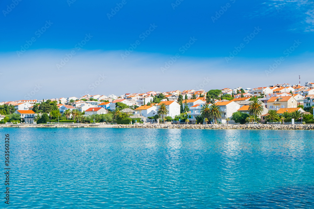 Croatia, town of Novalja on the island of Pag, marina with boats and turquoise sea in foreground, tourist destination on Adriatic sea