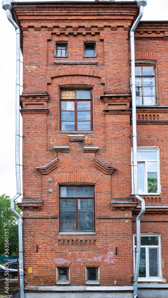 Fototapeta premium Architectural detail tower outbuilding old red brick residential house.