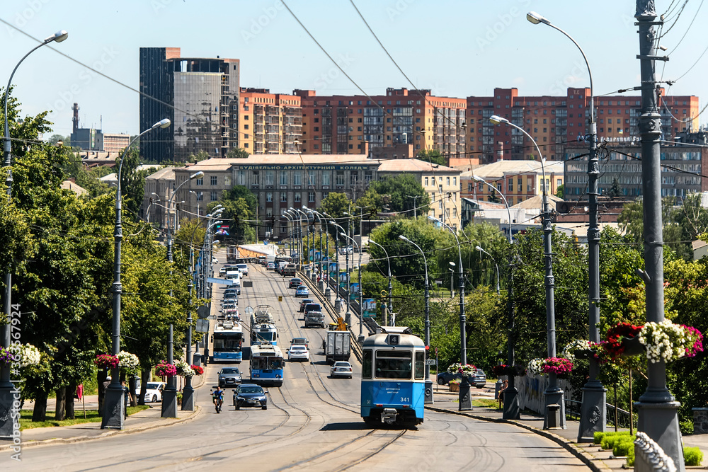 Obraz premium Aerial view of Soborna Street and bridge over Southern Bug river with public transport in Vinnytsia, Ukraine. July 2020