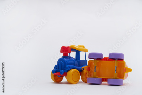 toy cars collided in an accident on a white background Crash on a toy road