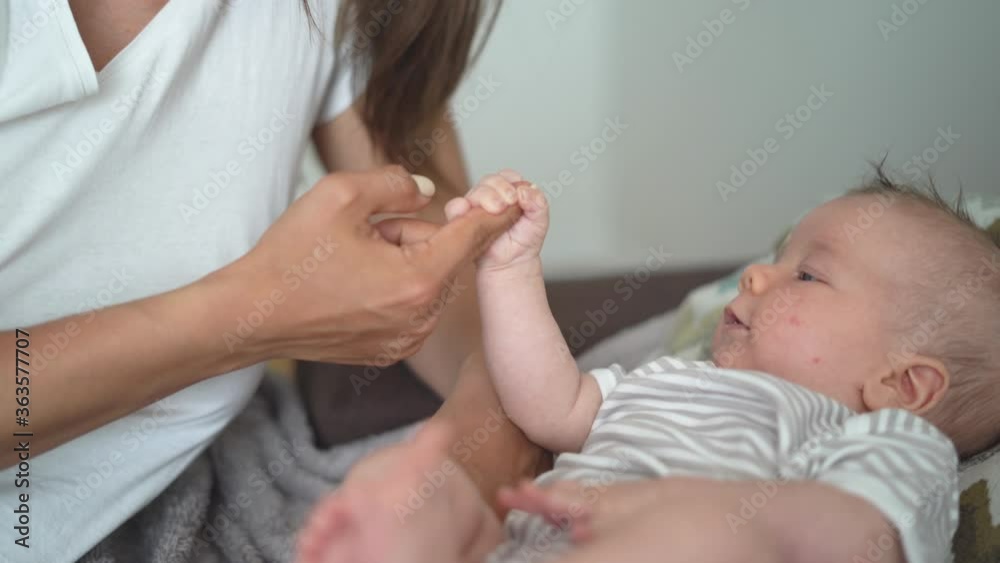 young beautiful mother is playing with her baby. Happy motherhood. cheerful son. young beautiful mother is playing with her baby. Happy motherhood. cheerful son.