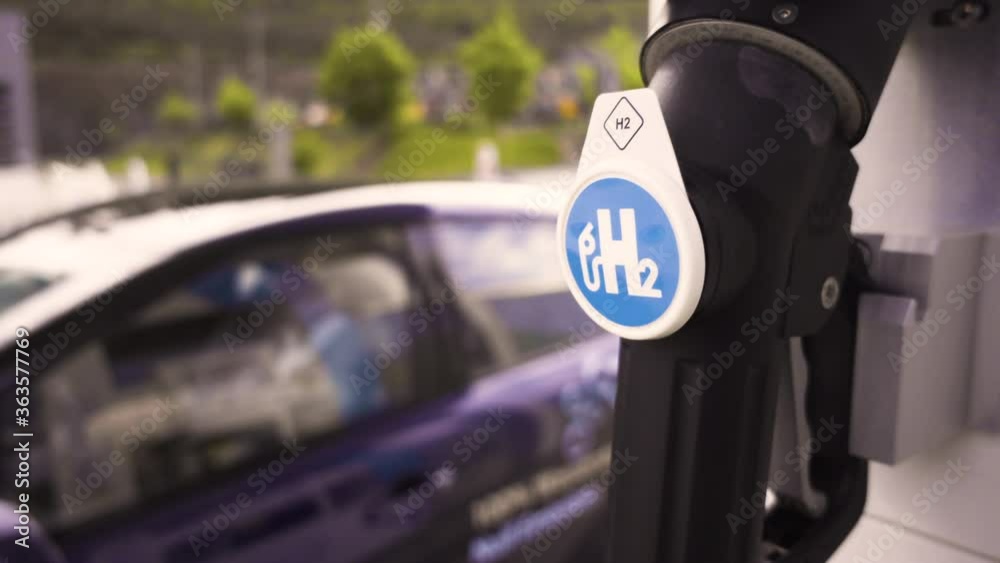 Fuell Cell Technology vehicle arrives at hydrogen gas station and gets filled up. Fill up of hydrogen car at H2 gas station