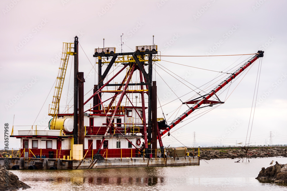 old dredging ship near the wetlands  on the border of San Francisco Bay 