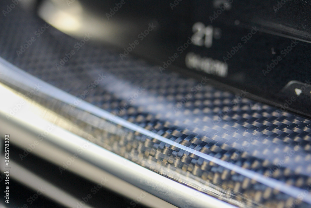 Macro of carbon weave in vehicle Macro of carbon weave in vehicle