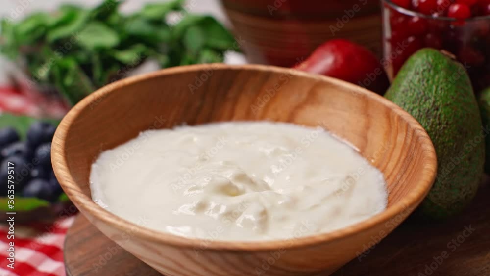 selective focus of man holding spoon with tasty yogurt selective focus of man holding spoon with tasty yogurt