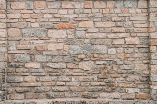 An old stone medieval wall  a natural background  a replica of the cosmos.