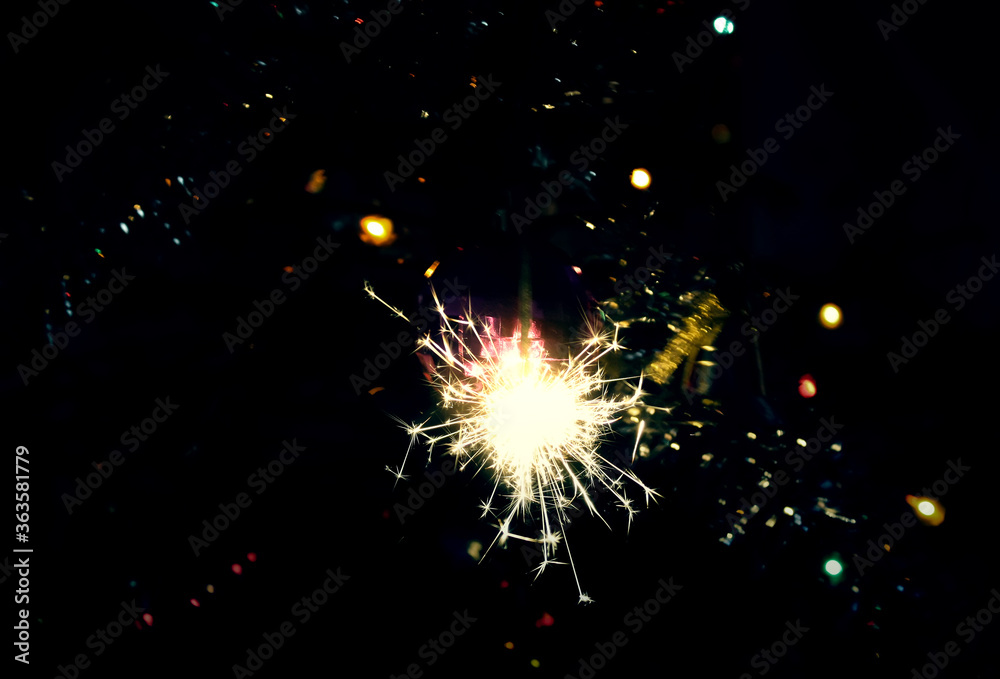 Obraz premium Bengali fire. Festive firework salute burst. Festive new year background.