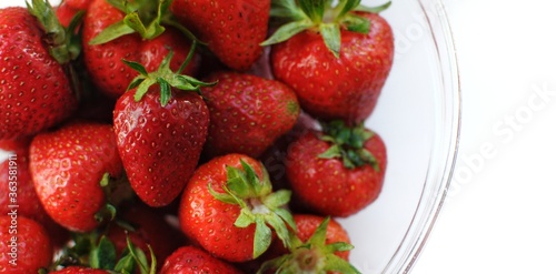 Banner of home strawberry with copy space. Summer vitamin fruits in a bowl.