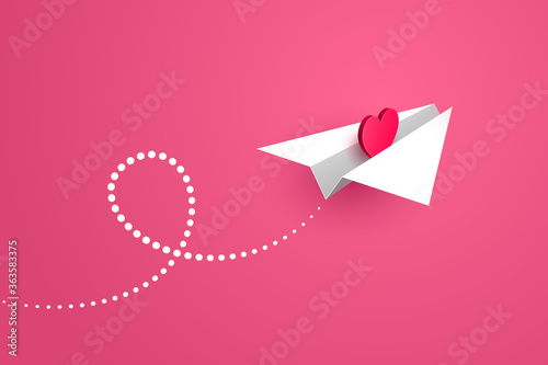 Paper airplane with heart symbol inside is flying over pink background