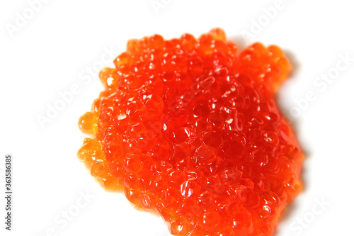 Red caviar on a white background. Seafood. Expensive food. A handful of red caviar