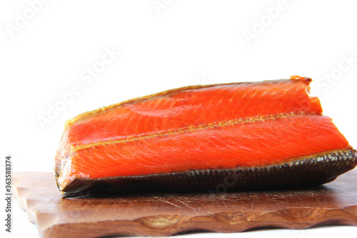 A piece of red fish on a white background. Raw red fish. Seafood