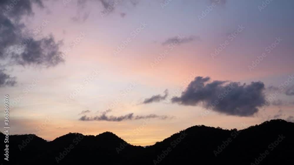Time lapse beautiful sun rise sky with clouds flow through hill.