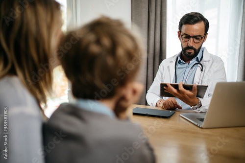 a doctor makes a consultation to a family