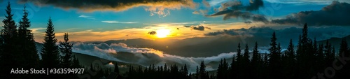 фотографія Beautiful sunset in mountain forest wide panorama