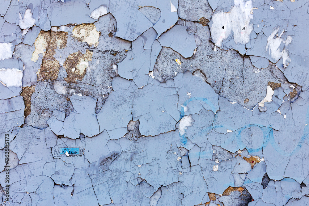Obraz premium Abstract creative background of chaotic strokes of old cracked paint on concrete wall. Old surface with traces of paint, weathered, scratches and cracks for design
