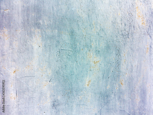 Creative background of rusty metal with cracks and scratches, casually painted white. Grungy metal surface. Great background or texture for your project.