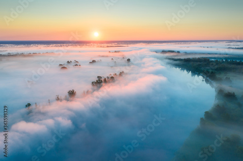 Summer landscape with fog over river © alexugalek