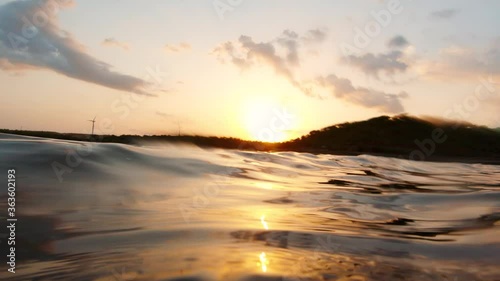 Reflection of sun in water of Vadsar Lake at Wankaner, Gujarat, India photo