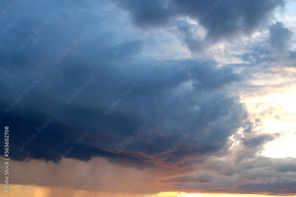 Ominous and dark dramatic stormy cloudscape with sunlight Ominous and dark dramatic stormy cloudscape with sunlight